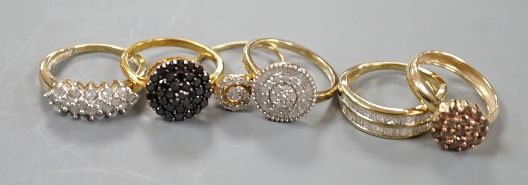 Four assorted modern 9ct gold and white or coloured diamond cluster set dress rings and two similar rings set in gilt 925